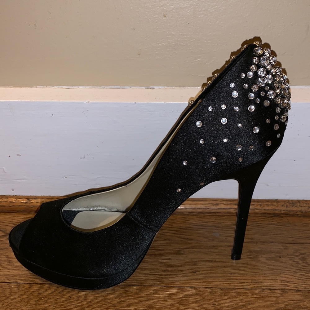Women’s black open-toed heels.